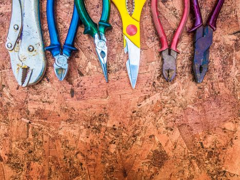 Set of hand tools on a wooden panel