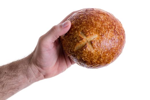 Clean muscular male hand giving or passing over a freshly baked crusty sourdough bread roll isolated on white
