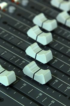 Closeup buttons equipment in audio mixing console