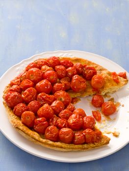 close up of rustic cherry tomato tarte tatin