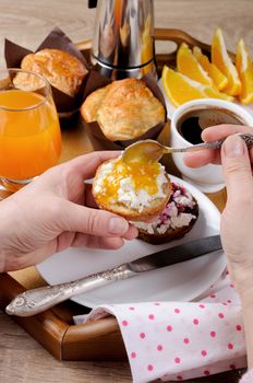 bun with   cheese cottage orange   jam for breakfast
