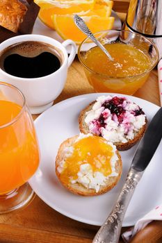 bun with ricotta orange and cherry jam for breakfast