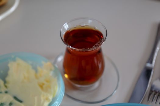 Close up detailed view of hot black tea in a glass.