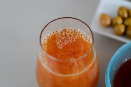 Close up detailed view of fresh orange juice in a glass