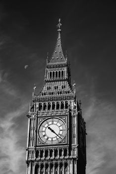 The Clock Tower in London, half Moon on its left, black and white photography, in England, UK