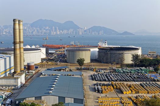 petrochemical industry on sunset , hong kong coal power station and oil tank