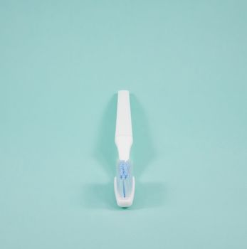 The clean white toothbrush for brushing the teeth.