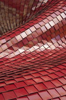Covering of a building with the use of modern tiles of red color