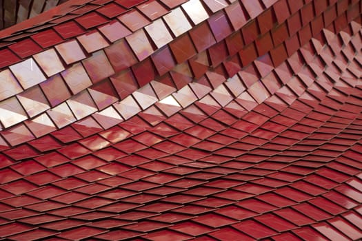 Covering of a building with the use of modern tiles of red color
