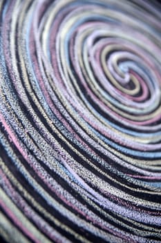 Spirals of different colors drawn with chalk on blackboard