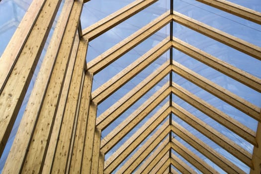 Modern cover made of laminated beams and glass plates