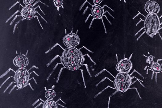 Graphic representation with chalk on the blackboard of arachnophobia fear of spiders