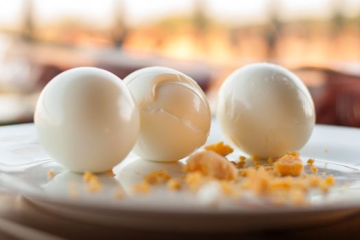 Three boiled eggs at plate 