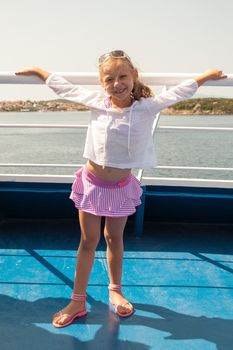 Cute little girl at the deck a boat
