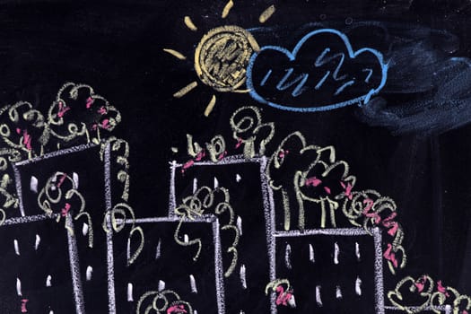 Graphical representation made with chalk on the blackboard of a silhouette of city