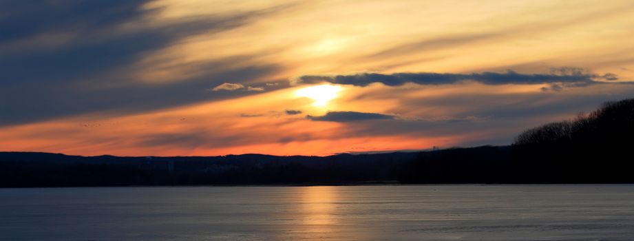 Beautiful picture of the amazing sunset on the icy lake