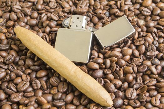 cigar and cigarette lighter on the coffee beans background