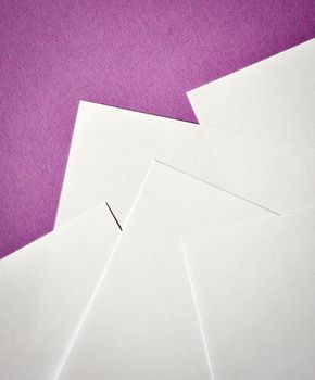 abstract White paper leaflets on a purple background