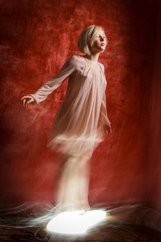 Ghost digital girl on red grunge weathered wall background