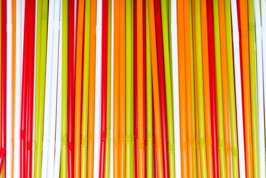 The colorful plastic tubes background and texture