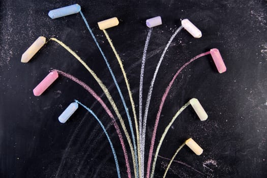 Representation drawn with chalk on the blackboard of a colorful tree