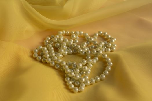 White Pearl Necklace with a Yellow soft silk