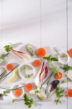 Presentation of mixed salad with peas, carrots and fennel