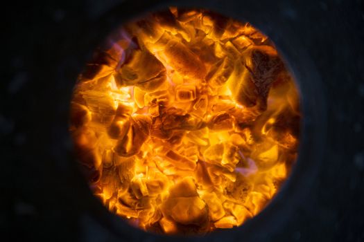 Embers from the burning of wood in a stove