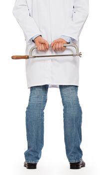 Crazy doctor is holding a big saw in his hands, isolated on white