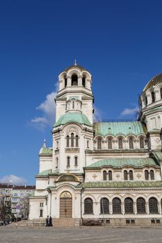 View of famous Bulgarian Orthodox church of Alexander Nevsky Cathedral built in 1882 in Sofia, Bulgaria, on blue sky background.