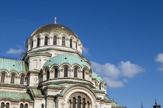 Close up detailed view of famous Bulgarian Orthodox church of Alexander Nevsky Cathedral built in 1882 in Sofia, Bulgaria, on blue sky background.