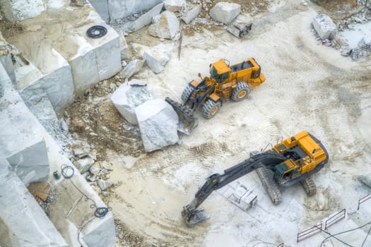 Broad view of the process in the white marble quarries in Carrara Italy