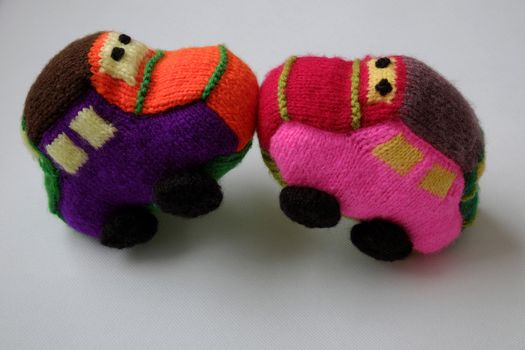 Handmade gift for children, two colorful baby car knit from yarn, funny emotion on couple car, homemade toy as amazing present