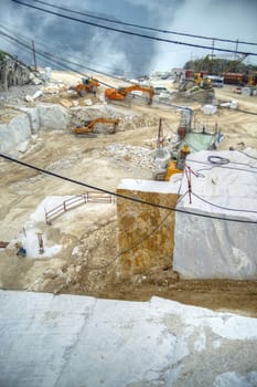 Broad view of the process in the white marble quarries in Carrara Italy