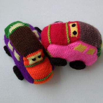 Handmade gift for children, two colorful baby car knit from yarn, funny emotion on couple car, homemade toy as amazing present