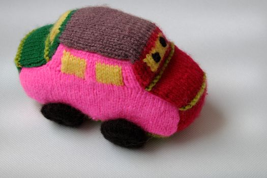 Handmade gift for children, two colorful baby car knit from yarn, funny emotion on couple car, homemade toy as amazing present