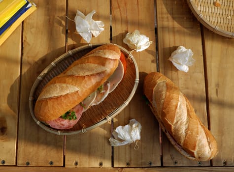 Vietnamese food, banh mi Viet Nam, a famous eating for morning with tasty and convenient for modern life, bread on table for breakfast as fast food product in Vietnam