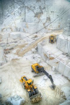 Broad view of the process in the white marble quarries in Carrara Italy