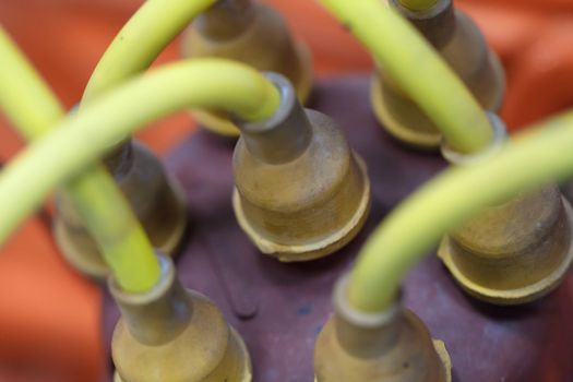 Close up detailed view of historical old green plastic cables and pipes.