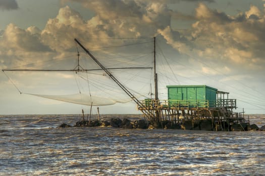 Traditional wooden buildings for fishing situated on the estuary of the River Arno Tuscany Italy.