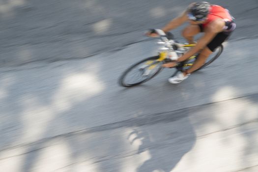 Cycling race with representation runner with blur