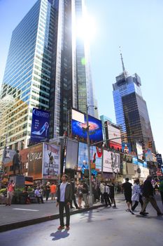 New York, NY, USA - May 17, 2013: Times Square, featured with Broadway Theaters and huge number of LED signs, is a symbol of New York City and the United States, May 17, 2013 in Manhattan, New York City