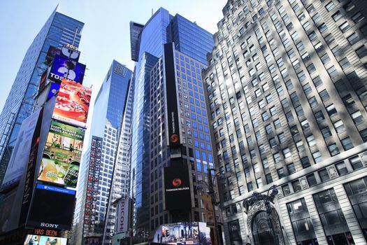 New York, NY, USA - May 17, 2013: Times Square, featured with Broadway Theaters and huge number of LED signs, is a symbol of New York City and the United States, May 17, 2013 in Manhattan, New York City