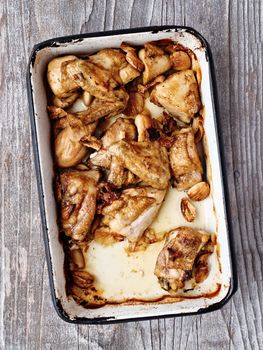 close up of rustic golden roast chicken casserole 