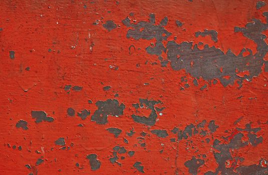 Red stained corroded rusty painted vintage old metal surface with flakes and scratches