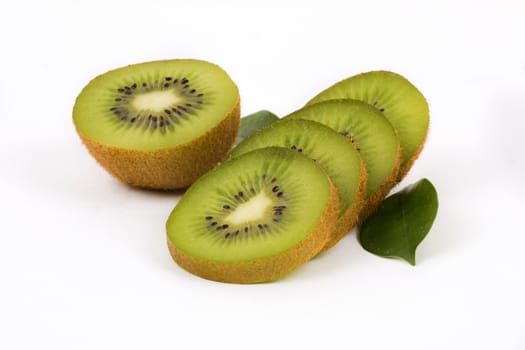 Fresh kiwi with slices and leaves on a white background