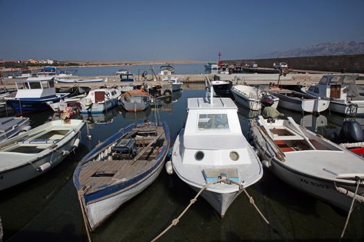 Old boats in harbor at Adriatic sea. Vinjerac, Croatia, popular touristic destination