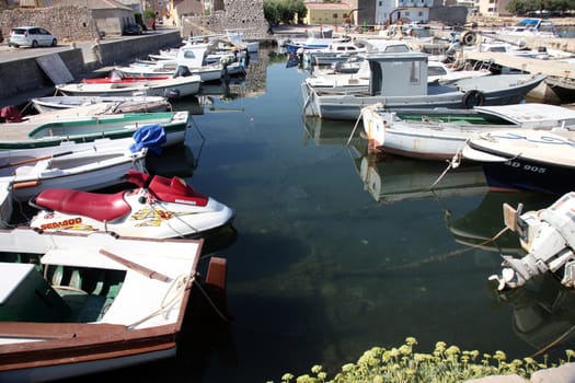 Old boats in harbor at Adriatic sea. Vinjerac, Croatia, popular touristic destination
