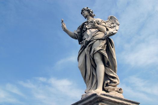 Bernini's angel along the Holy Angel bridge near the Hadrian Mausoleum in Rome, Italy