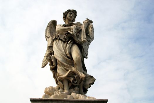 Bernini's angel along the Holy Angel bridge near the Hadrian Mausoleum in Rome, Italy